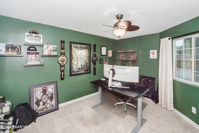 home office with light carpet and ceiling fan