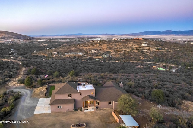 aerial view at dusk with a mountain view