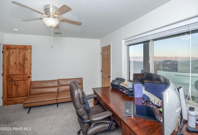 office with ceiling fan and carpet floors