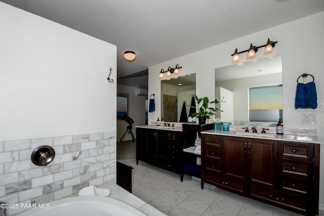 bathroom featuring vanity and a tub to relax in