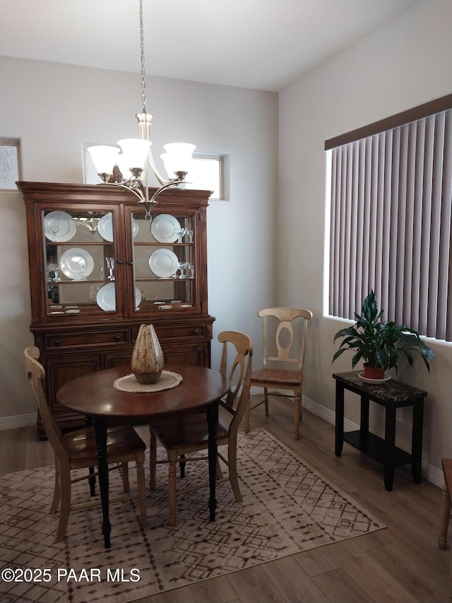 6166 E Shetland Way, Prescott Valley, AZ 86314 - dining room with a chandelier, light wood finished floors, and baseboards