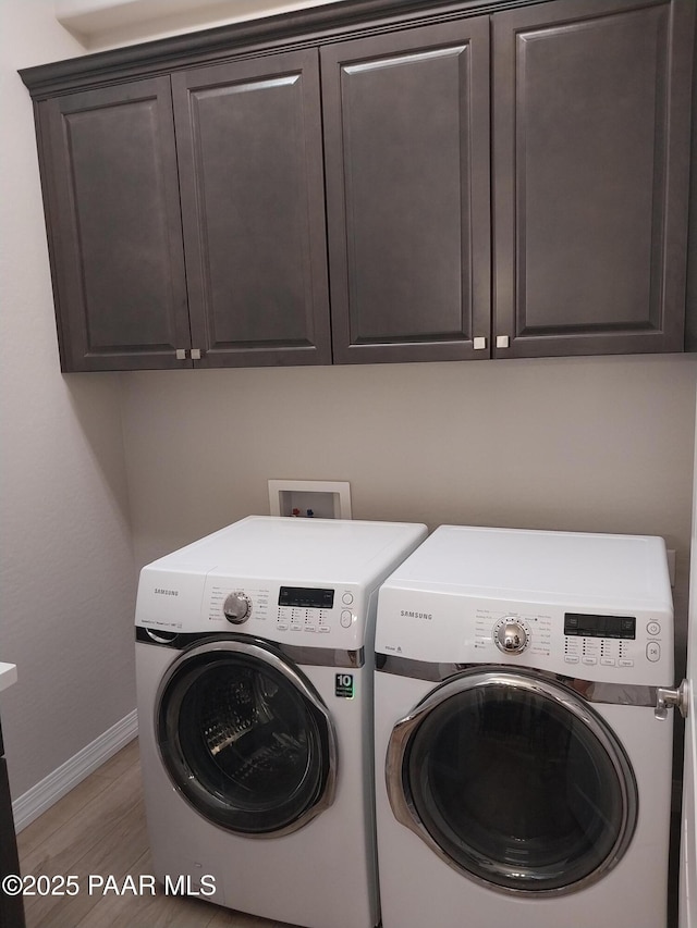 6166 E Shetland Way, Prescott Valley, AZ 86314 - laundry room with independent washer and dryer, cabinet space, and baseboards