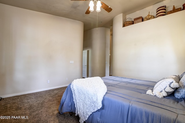 carpeted bedroom featuring baseboards and a ceiling fan