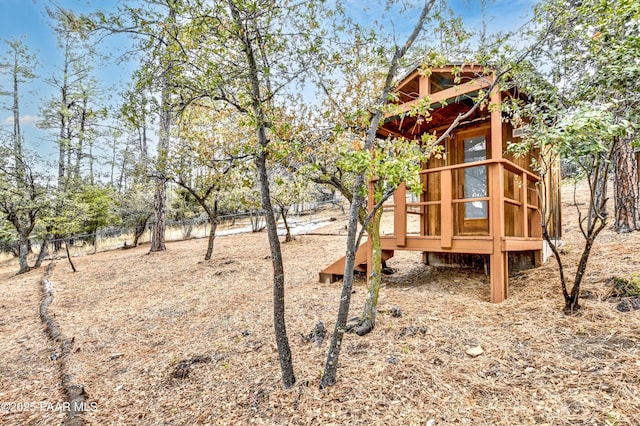 view of jungle gym with fence