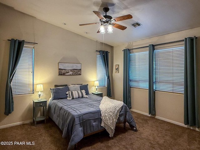 bedroom with carpet, visible vents, baseboards, lofted ceiling, and ceiling fan