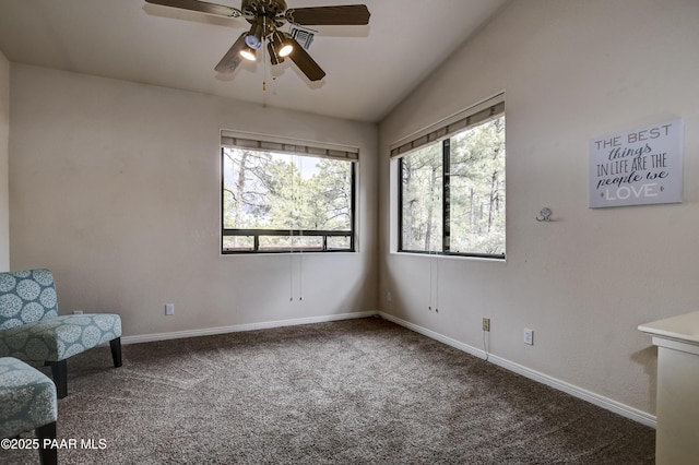 living area featuring carpet flooring, ceiling fan, baseboards, and lofted ceiling