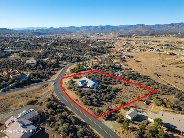 birds eye view of property featuring a mountain view