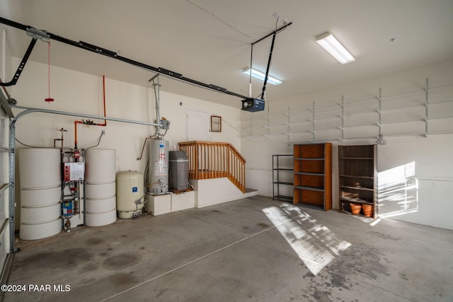 garage featuring gas water heater and a garage door opener