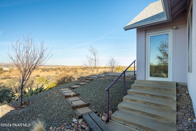 view of yard with a rural view