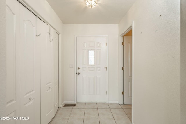 entryway featuring light tile patterned flooring