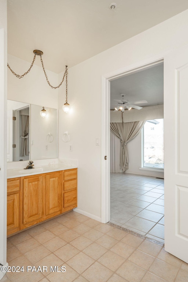 bathroom with tile patterned floors, ceiling fan, and vanity