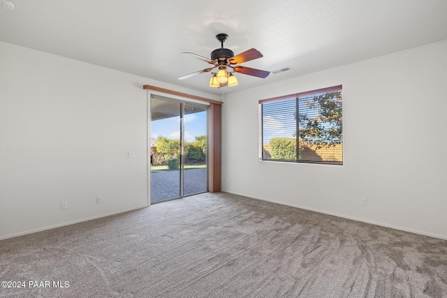 carpeted empty room with ceiling fan