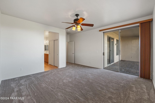 unfurnished bedroom with ensuite bathroom, ceiling fan, and light colored carpet