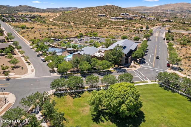 birds eye view of property with a mountain view