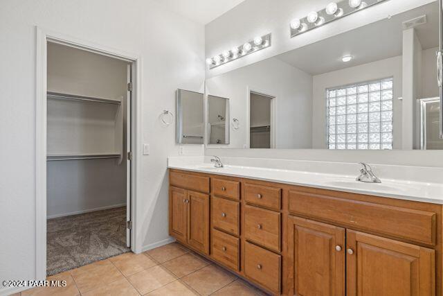 bathroom with tile patterned floors and vanity