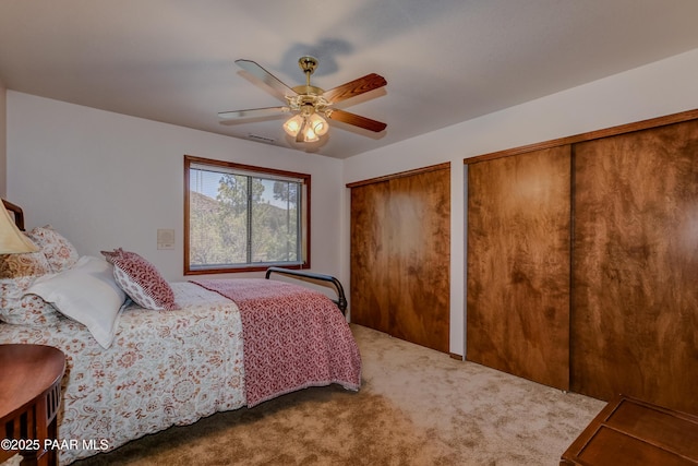 1585 Range Rd, Prescott, AZ 86303 - bedroom with two closets, carpet, and ceiling fan