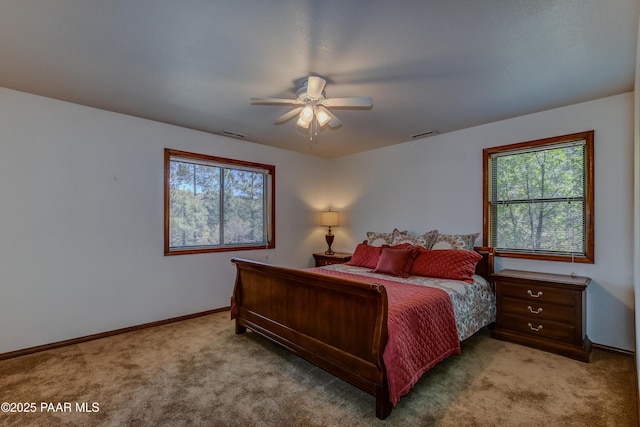 1585 Range Rd, Prescott, AZ 86303 - carpeted bedroom featuring multiple windows, baseboards, and a ceiling fan