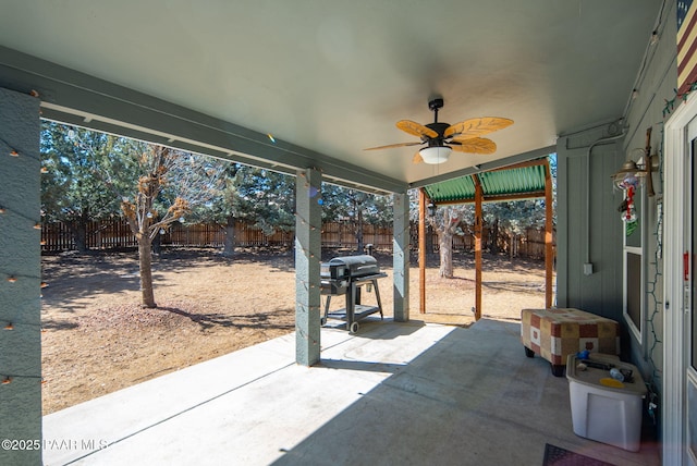 view of patio / terrace featuring a ceiling fan, a fenced backyard, and grilling area