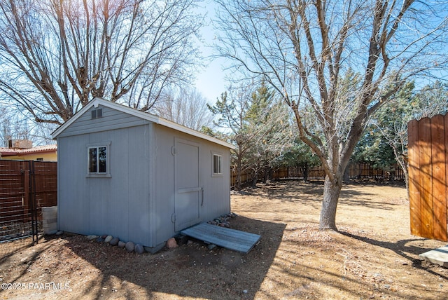 view of shed with a fenced backyard