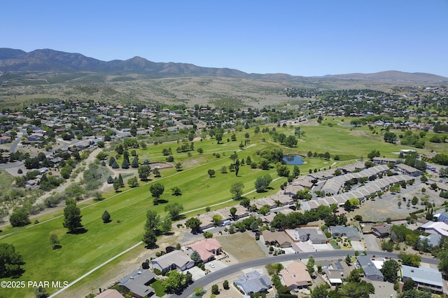 birds eye view of property featuring golf course view, a residential view, and a water and mountain view