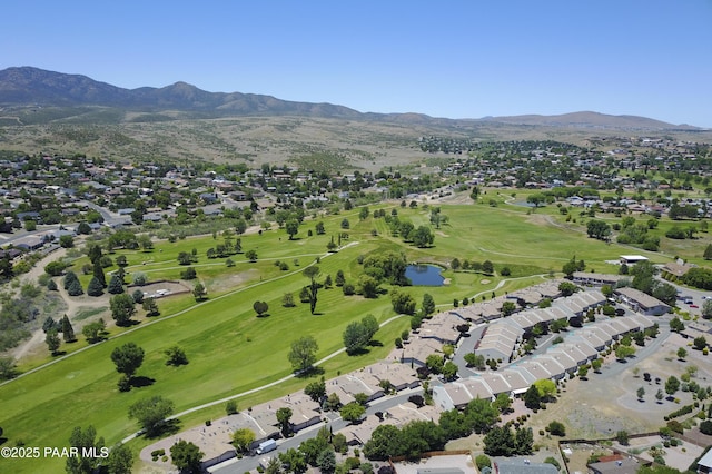 birds eye view of property featuring view of golf course, a residential view, and a water and mountain view