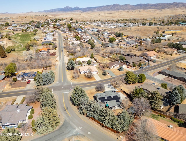 birds eye view of property with a mountain view and a residential view