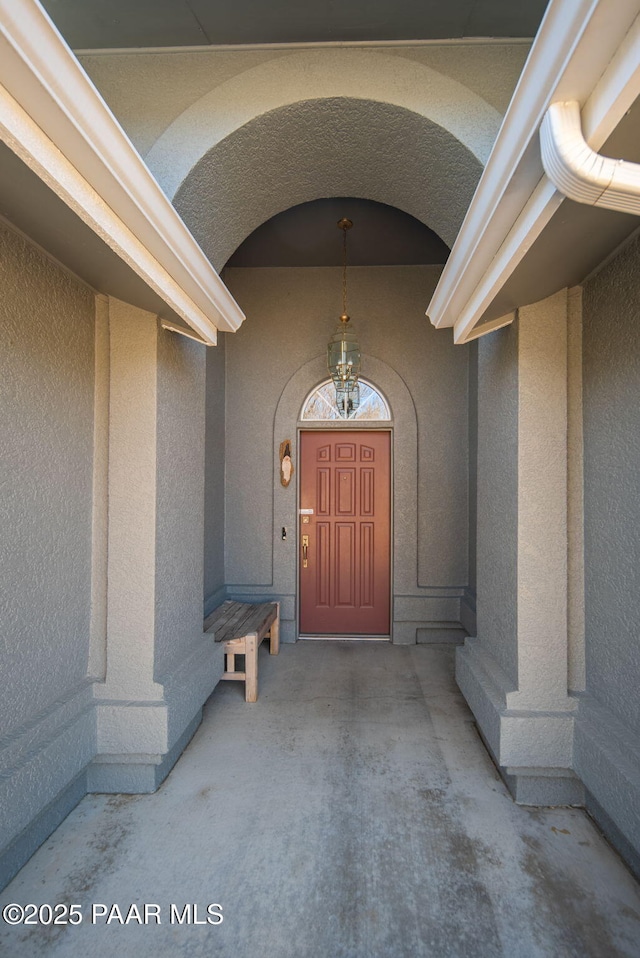 doorway to property with stucco siding