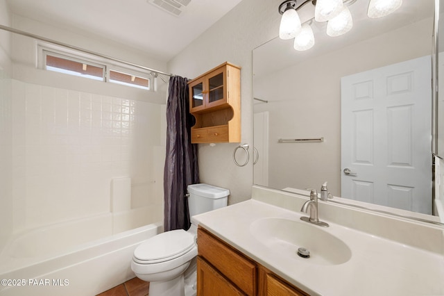 full bathroom featuring vanity, shower / tub combo with curtain, tile patterned floors, and toilet