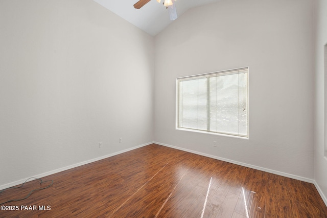 unfurnished room featuring high vaulted ceiling, dark wood-type flooring, and ceiling fan