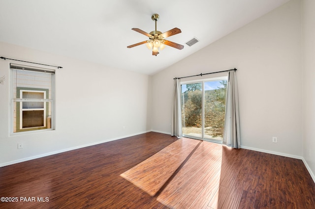 unfurnished room featuring dark wood-type flooring, ceiling fan, and vaulted ceiling