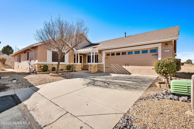 view of front of home featuring a pergola and a garage