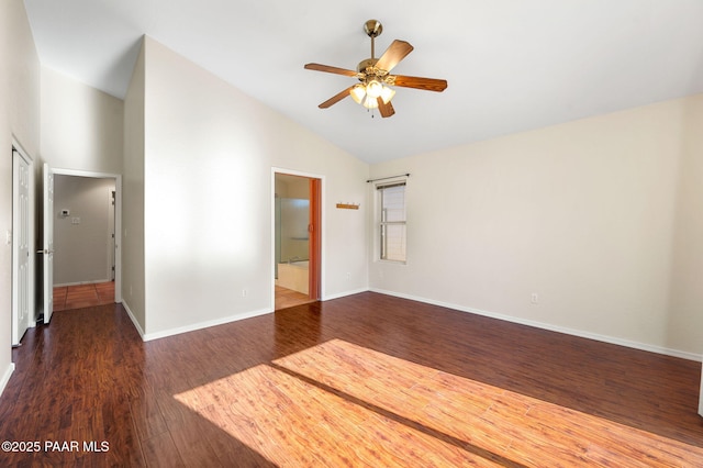 empty room featuring dark wood-type flooring, ceiling fan, and high vaulted ceiling