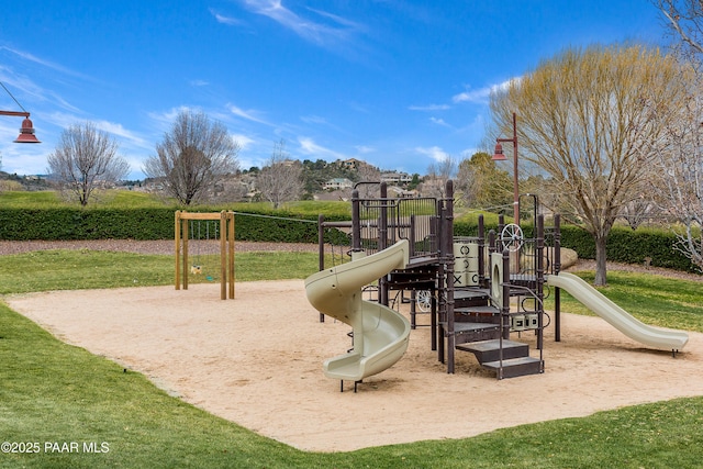 view of playground featuring a lawn