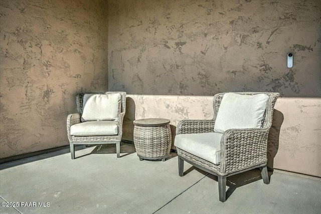 living area featuring concrete flooring