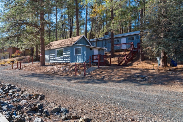 view of front of home featuring a wooden deck