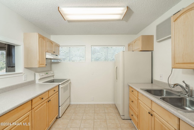 kitchen featuring sink, a textured ceiling, white appliances, light brown cabinetry, and light tile patterned floors