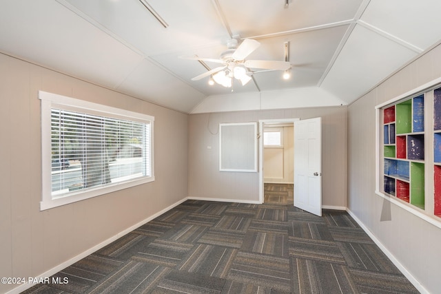 unfurnished bedroom featuring ceiling fan and lofted ceiling