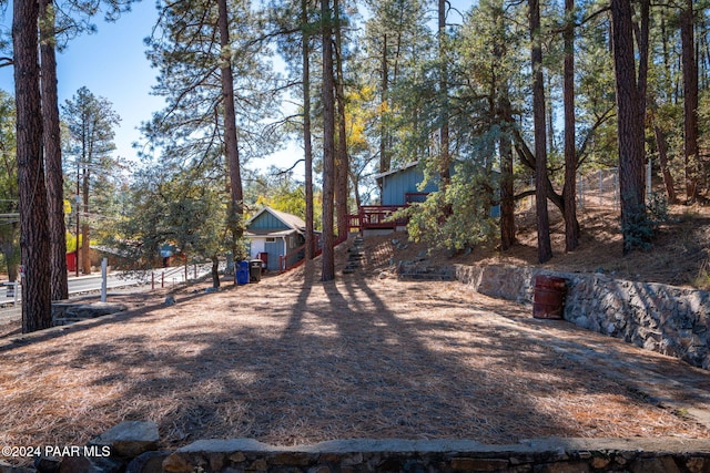 view of yard with a wooden deck