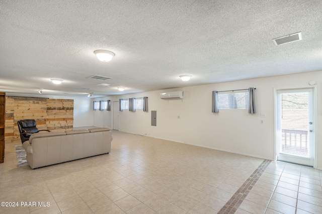 tiled living room featuring an AC wall unit and wooden walls