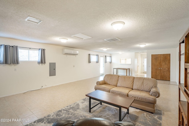 living room with a textured ceiling, electric panel, and a wall mounted AC