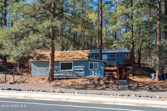 view of front of property featuring a wooden deck