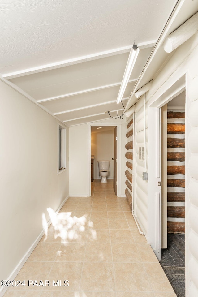 corridor featuring tile patterned flooring