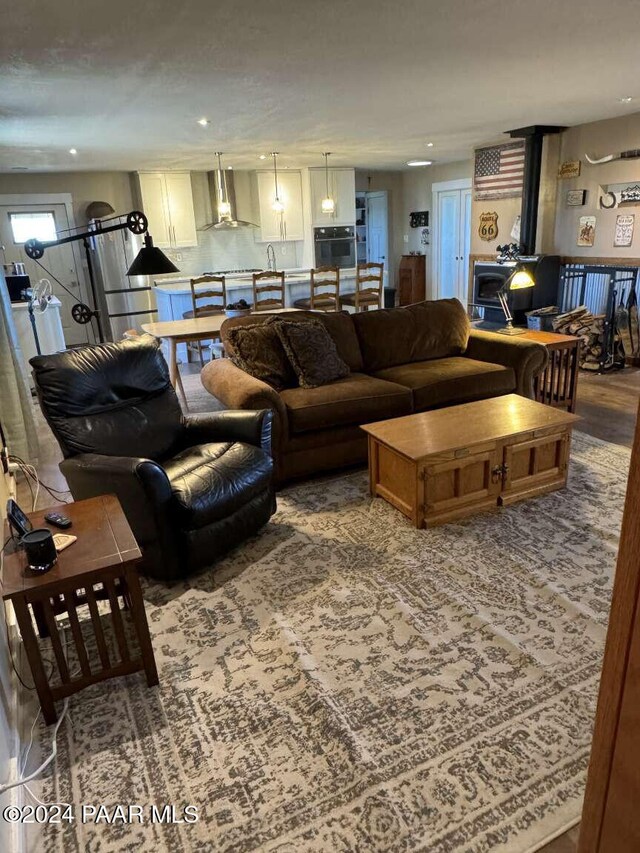 living room with a wood stove