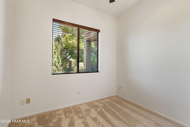 6723 E Arden Ct Unit 5, Prescott Valley, AZ 86314 - spare room featuring light carpet, baseboards, and a ceiling fan