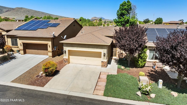 6723 E Arden Ct Unit 5, Prescott Valley, AZ 86314 - view of front of property with stone siding, driveway, stucco siding, and a mountain view