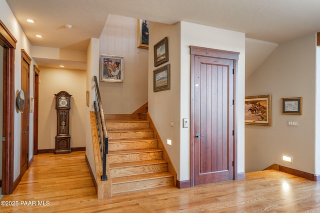 stairway featuring hardwood / wood-style floors