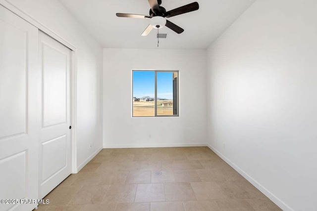 unfurnished bedroom with visible vents, baseboards, a closet, and a ceiling fan