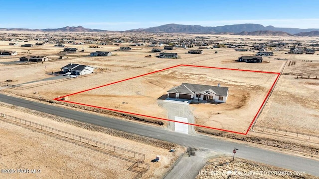 birds eye view of property with a rural view and a mountain view