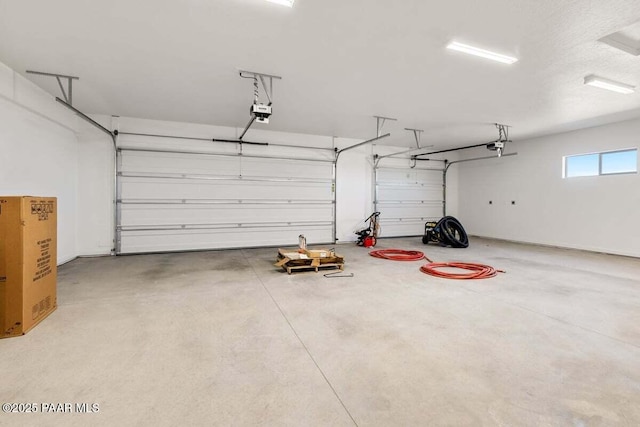 parking garage featuring a garage door opener