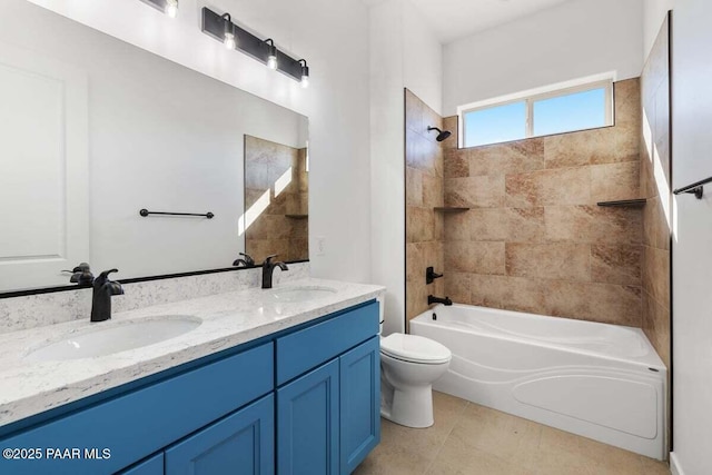 bathroom with double vanity, toilet, shower / tub combination, and a sink